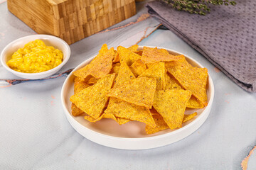 Corn nachos chips with cheese dip