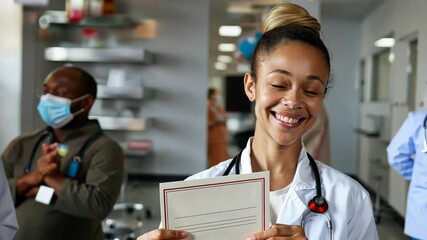 Joyful young woman holding a certificate for World Blood Donor Day as medical team applauds. World Blood Donor Day