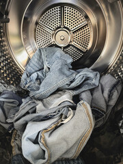 Jeans  was put in to washing machine bucket,prepare for clean,