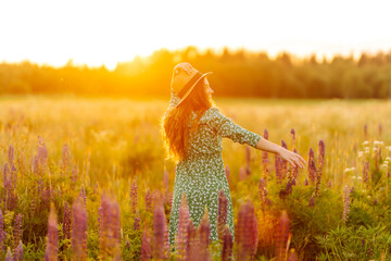 Happy Young Woman runs in lavender field, smiles against of bright sunset summer. Relax. Tourist. Lifestyle. Freedom. Travel