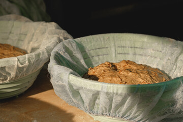 Freshly prepared dough resting in woven baskets, ready for the art of baking in a warm kitchen filled with the aroma of home-cooked meals