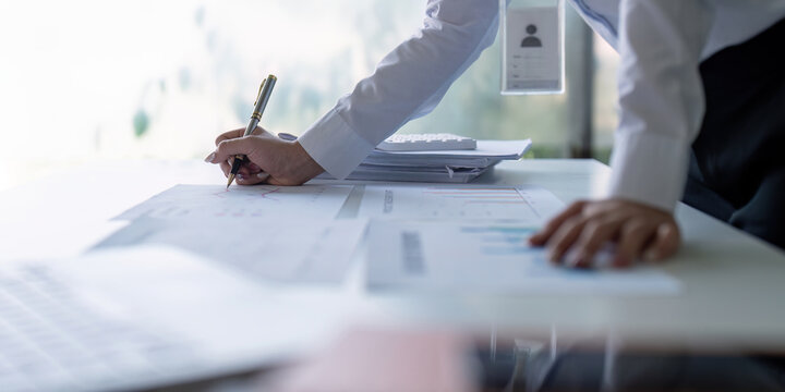 Accountant preparing financial reports and charts, showcasing analytical skills and strategic planning.