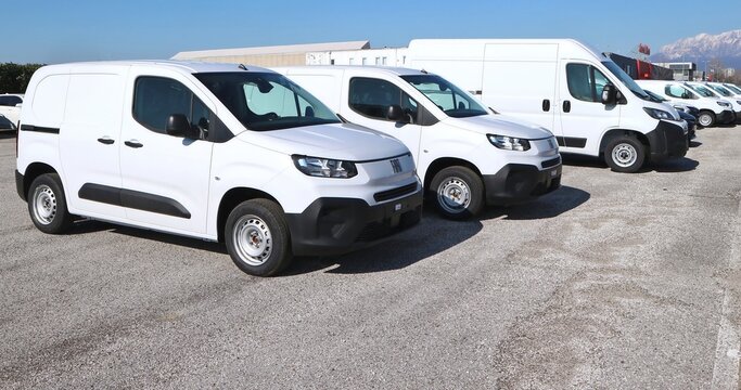 Tavagnacco, Italy. February 15, 2025. White Fiat Dobl&ograve;, panel vans in a row outside the car dealership.