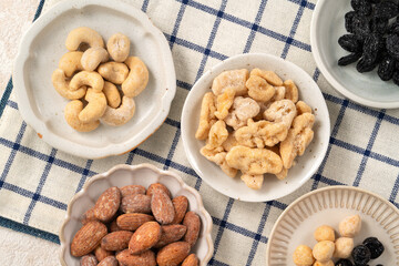 Flavored mixed nuts in bowls.