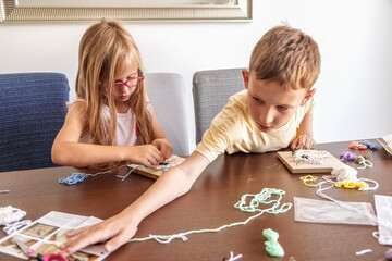 Kids use thread and nails to make shapes. They build skills, learn new things, and enjoy creative time.