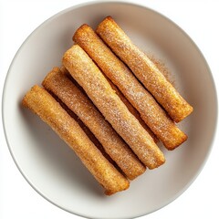 Five cinnamon sugar churros on white plate aligned in a single layer