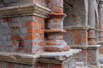 Fragment of ancient brickwork. Ancient red bricks in the wall.
