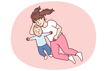Little girl hugging newborn brother lying in bed and falling asleep together for happy childhood concept. Caring preteen sister near carelessly sleeping little toddler resting after day walk