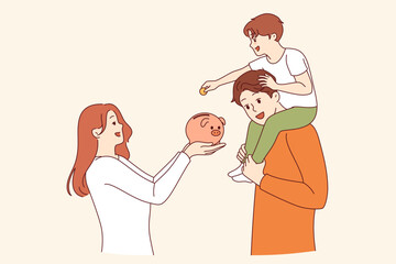 Teaching child financial literacy in young family, using pig piggy bank to save money. Parents who know about financial literacy help little boy accumulate first capital in preschool age.