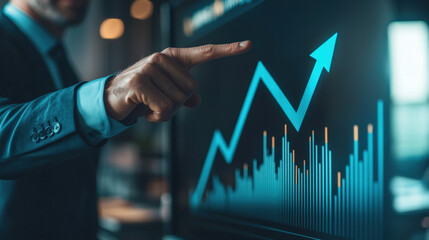 businessman pointing at rising graph on digital screen, symbolizing growth