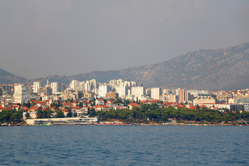 Obraz premium Contemporary buildings, gardens and beaches at the waterfront in Split, Croatia. View of Split from the boat.
