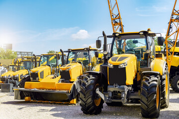 Yellow agricultural machinery at equipment dealership