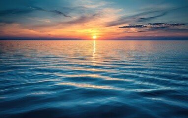 Fototapeta premium Peaceful sunset over a calm sea with gentle ripples