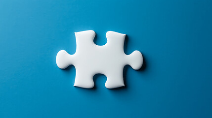 Obraz premium Single white puzzle piece on a blue background