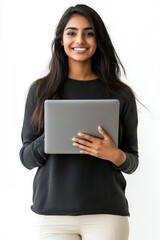 Fototapeta premium Smiling young Indian woman holding a laptop casual photo photography.