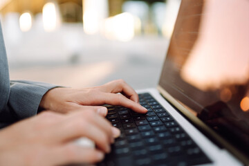 A person typing on a laptop. Close up. Businesswoman working with modern devices. Business, Freelance, Shopping, education. Online. Cyber security concept
