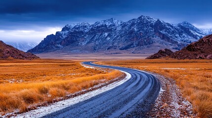 Winding Road Through Snowy Mountains