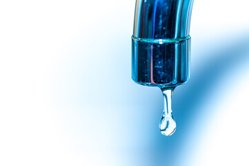 Tap from which drops of water flow. Drought, shortage, rationing and proper use of water.

