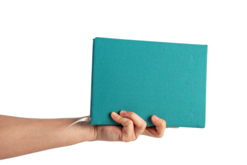 Blank blue book cover in hand on transparent background.