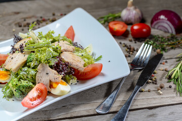 Caesar salad with chicken and fresh salad
