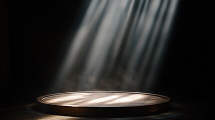 Dramatic spotlight on a round wooden platform in a dark room, creating a mystical atmosphere.