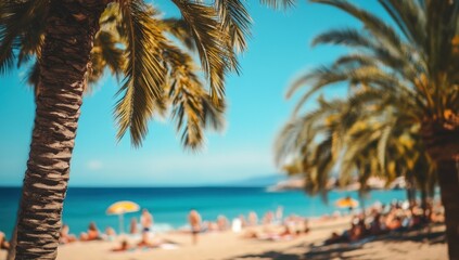 Fototapeta premium Sunny beach scene with palm trees and blurred people.
