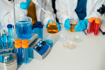 Lab work, Doctor holds a test tube takes the test from a test tube in analysis, blood, DNA, test tube stand..