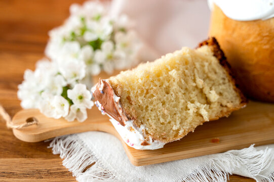 Appetizing Easter cake made from yeast dough, beautifully decorated, set against a soft pink background, perfect for celebrations