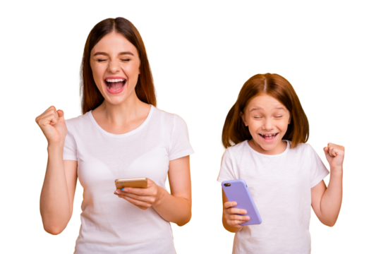 Portrait of two nice cheerful cheery glad satisfied dreamy person holding in hands device gadget great news isolated over bright vivid shine yellow background