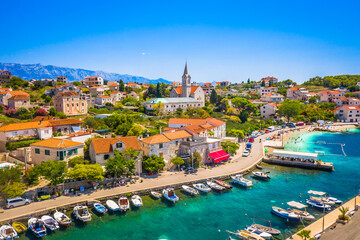 A charming view of Sumartin, a picturesque fishing village on Brac Island, Croatia, showcasing its traditional stone houses, scenic harbor, and serene Adriatic Sea, capturing the essence of Dalmatia