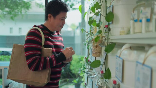 Customer fills cereal foods in a glass jar, lever the reusable container on refill store shelves, zero-waste and plastic-free grocery, environment-friendly, sustainable lifestyles.	
