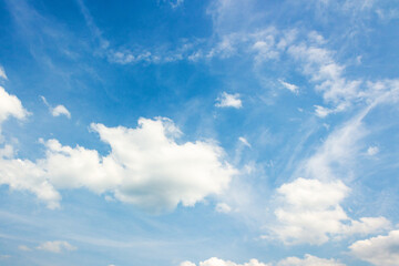 sky with fluffy clouds. natural environment. white cumulus cloudscape on a blue gradient of atmosphere. sunny summer weather. scenic nature background. beautiful view. meteorology backdrop. fresh air