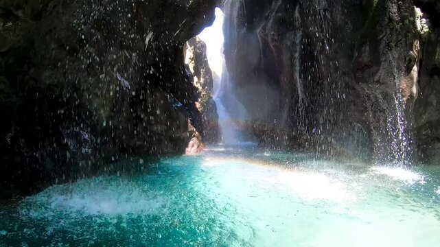 Walking through Kourtaliotiko Gorge, Crete, from the entrance, capturing breathtaking waterfalls, turquoise water, towering rock formations, and the serene beauty of this natural wonder.
