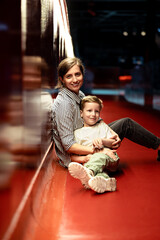 Fototapeta premium Mother and child relaxing in modern interior