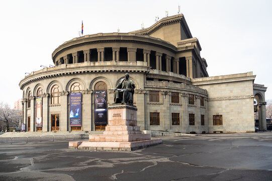 Yerevan, Armenia - February 15, 2025: Yerevan Opera Theater house and statue of composer Alexander Spendiaryan on Freedom Square in Yerevan city on overcast winter day