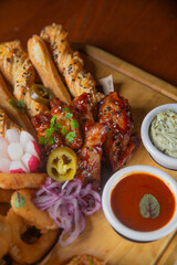 Deep fried battered snacks for beer on a wooden tray on the table