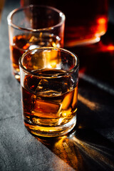 glass of whiskey on black background