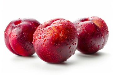 Obraz premium Trio of red plums on white background. AI image