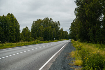 An empty road in the mountains at sunset