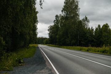 Fototapeta premium An empty road in the mountains at sunset
