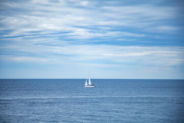 Fototapeta premium Yacht in the sea. Sailing boat on the sea. Sailboat on the sea. Horizon. Sea and blue sky