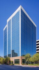 Obraz premium Modern Glass Skyscraper in Urban Setting
