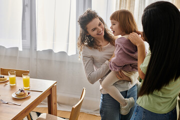 Joyful moments in a modern apartment with a loving LGBTQ family