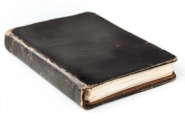 Obraz premium A vintage book with a black cover lying on a white surface, great for representing knowledge, wisdom or mystery