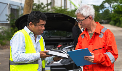 Car insurance agent man holding insurance document for car claiming checking damage with mechanic