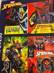 Naklejka premium Lviv, Ukraine - February 16, 2025: Colorful poster featuring Marvel's Spider-Man and Venom in dynamic artistic visuals