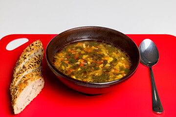 a bowl of spinach soup with vegetables