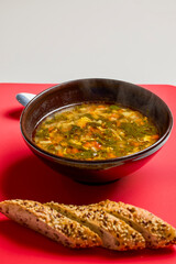 a bowl of spinach soup with vegetables
