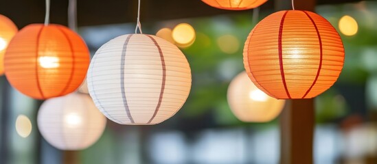 Illuminated Paper Lanterns Hanging Outdoors at Night
