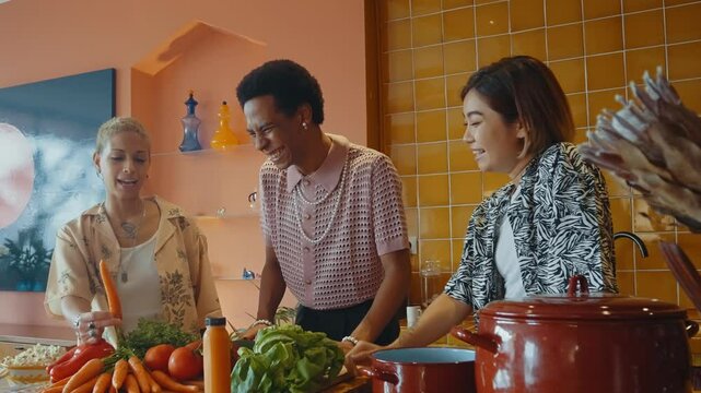 Group of friends bonding at home, LGBTQ and diversity concepts - Homosexual couple and fluid gender non binary young man with cross dressing clothing style having fun in the apartment, LGBT people